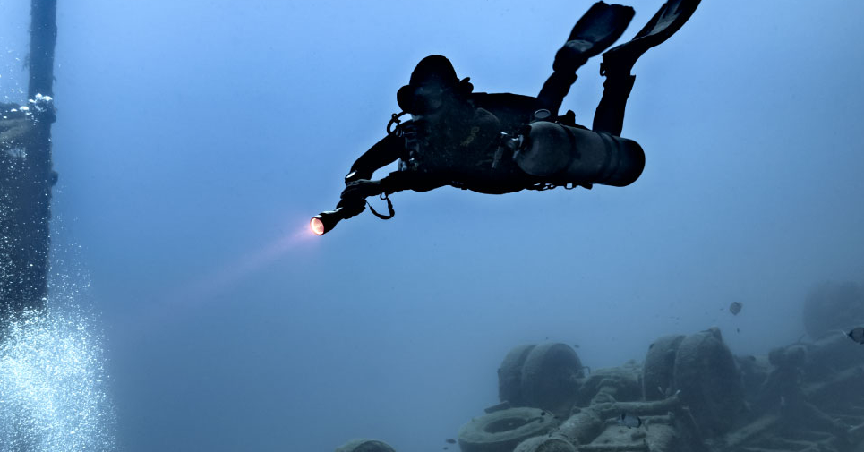 Divers returning from a night wreck excursion near the Toulon shoreline